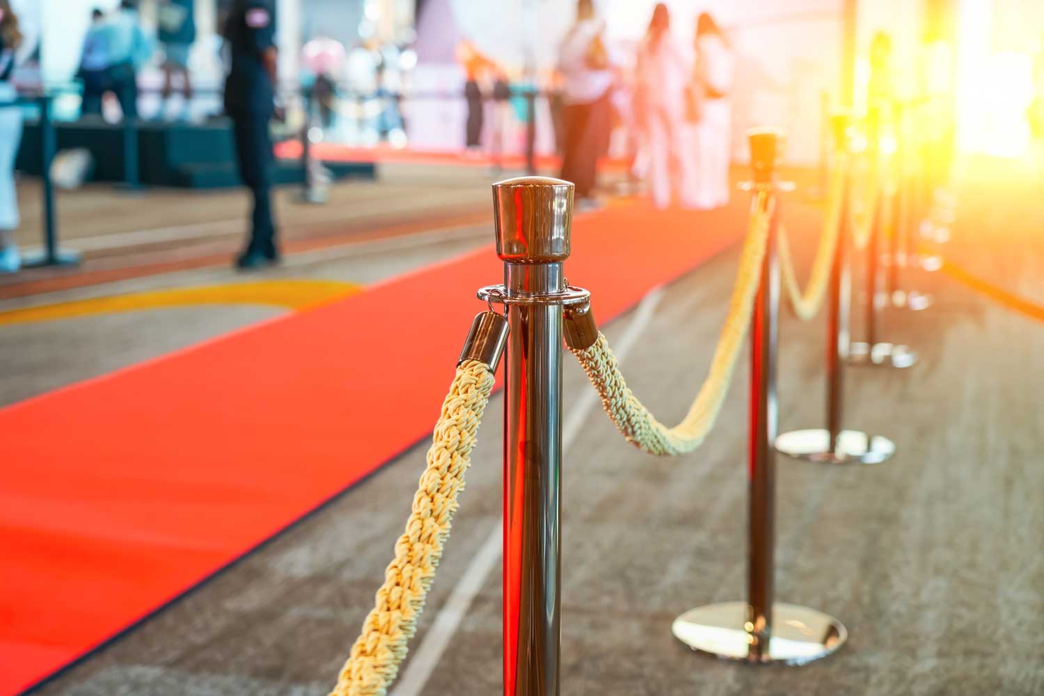 Red carpet and rope barriers set up at a formal event venue